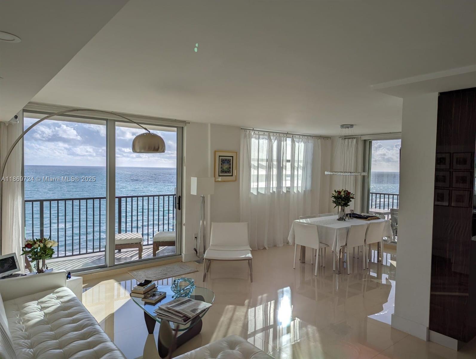 9273 Collins Avenue, Unit 1004 Surfside, FL 33154 - Photo 21 of 27 a living room with furniture and a window