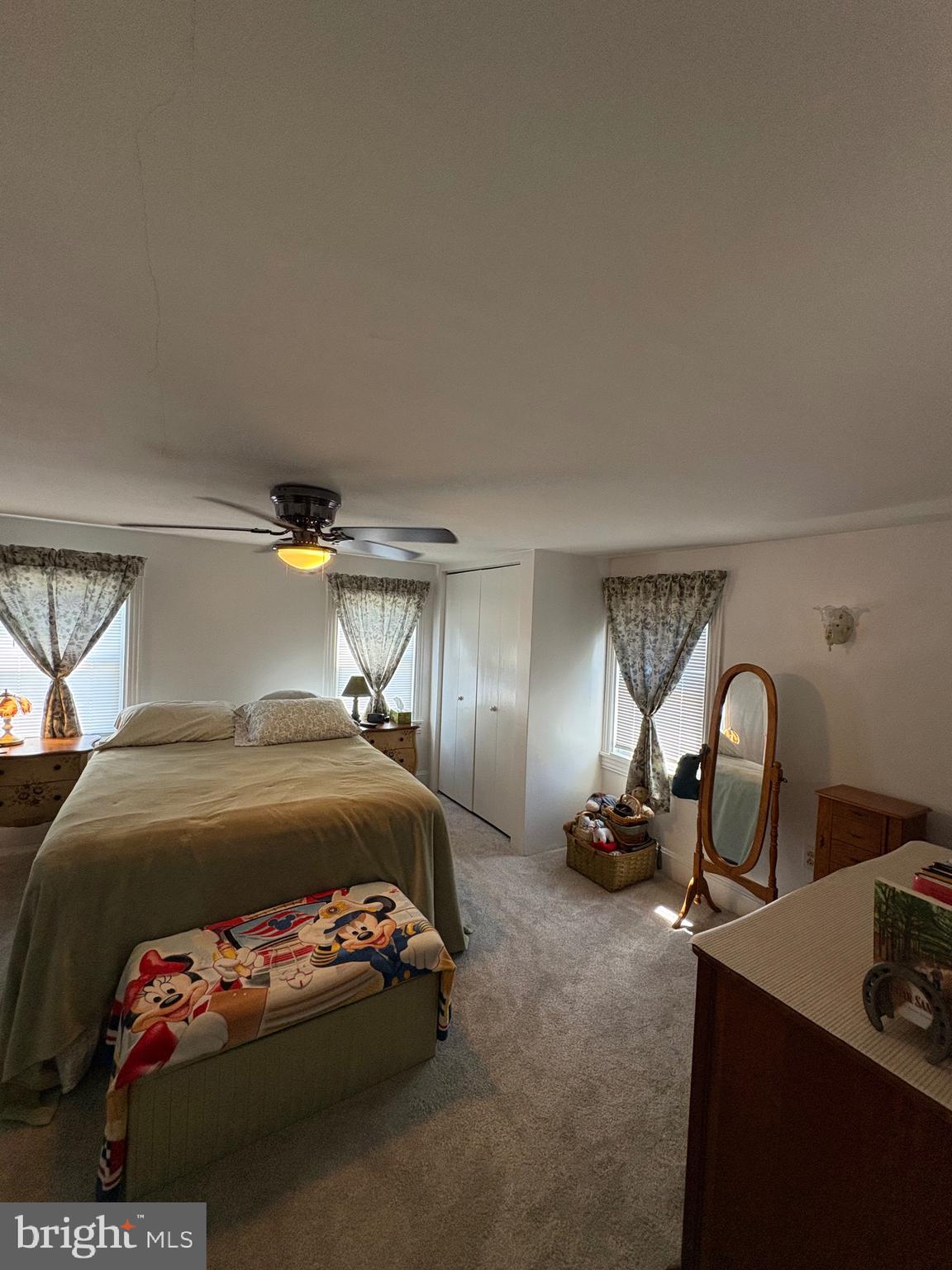 909 Main Street Salem, NJ 08079 - Photo 22 of 35 a bedroom with a bed and a dresser in it
