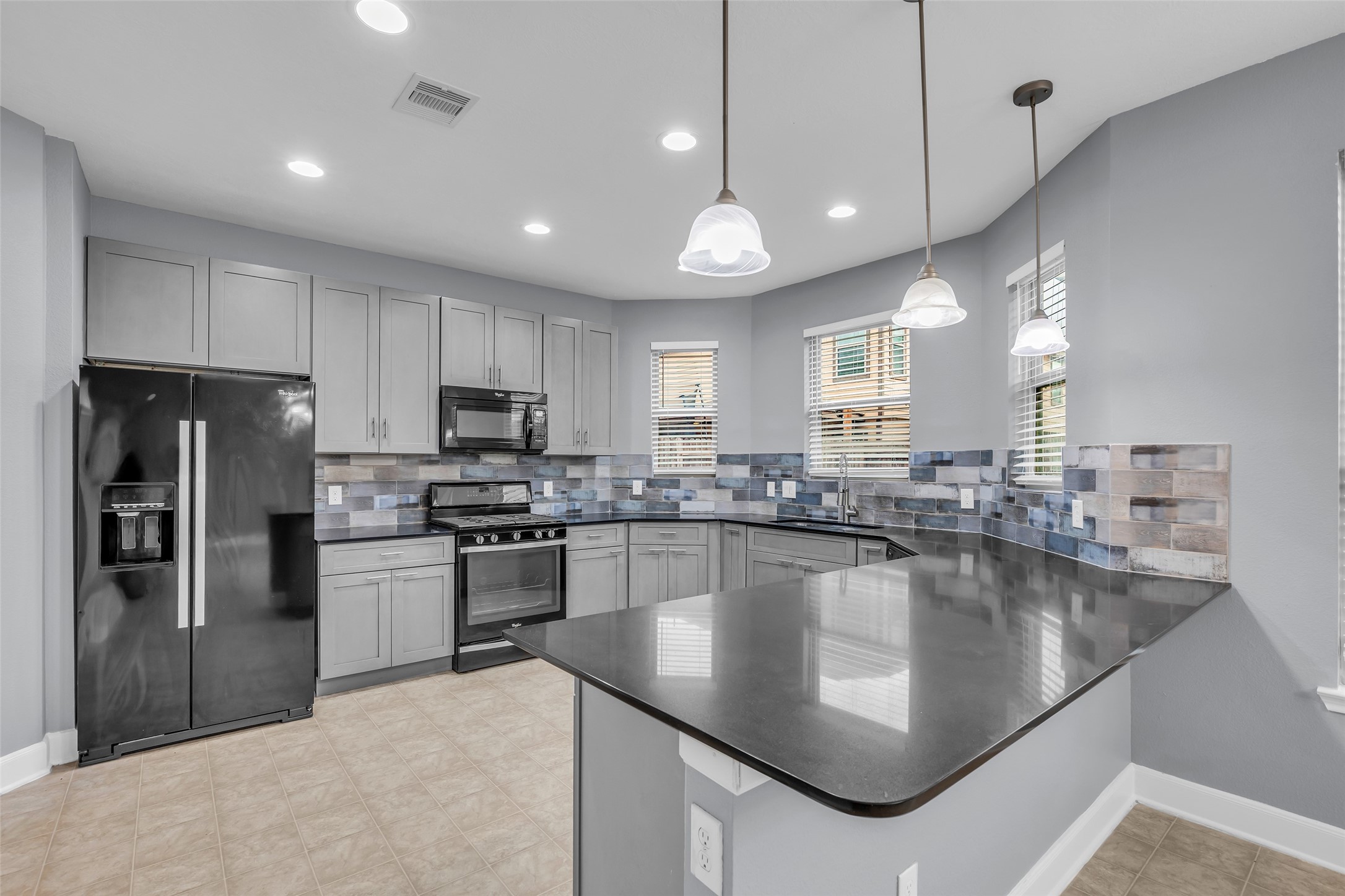 2707 Volute Houston, TX 77038 - Photo 12 of 28 This view of the kitchen shows its full layout, highlighting the overall arrangement and flow of the space.