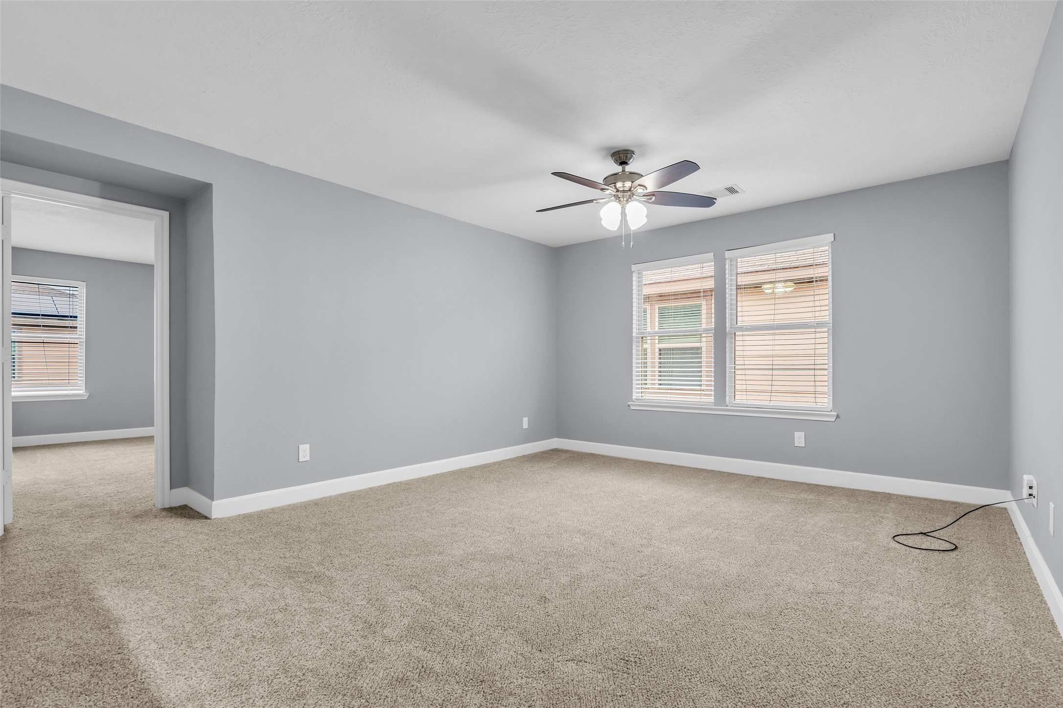 2707 Volute Houston, TX 77038 - Photo 16 of 28 Second-floor loft with carpeted flooring, providing a flexible space and direct access to the primary bedroom.