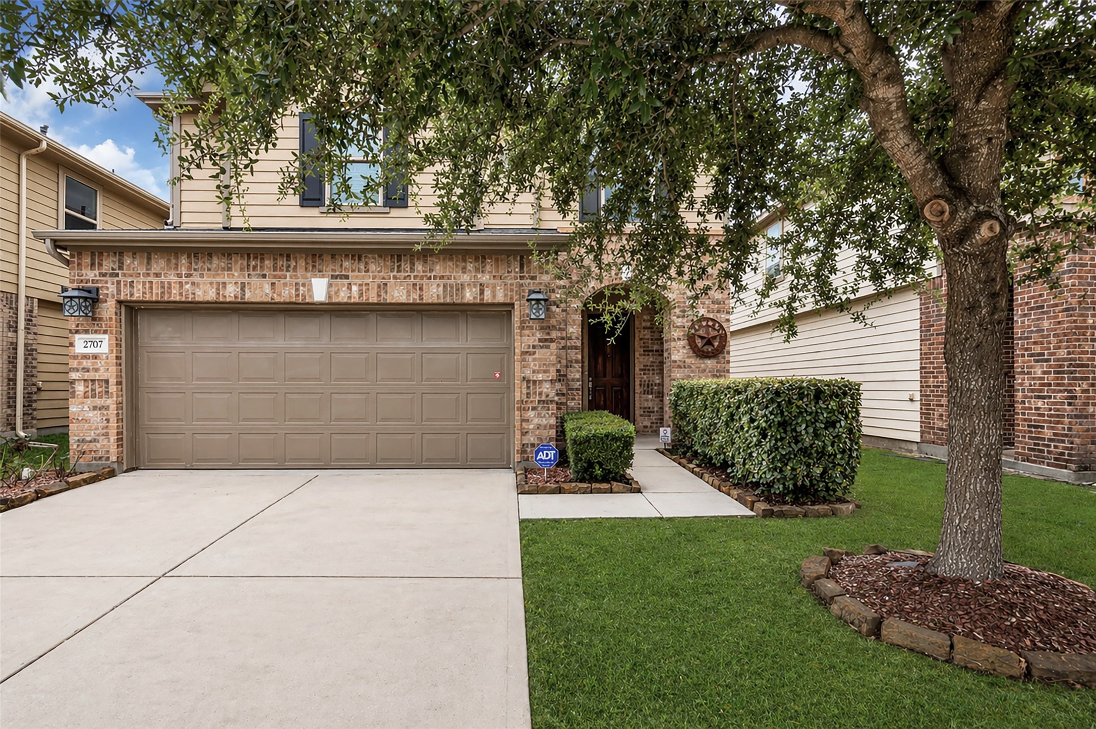 2707 Volute Houston, TX 77038 - Photo 2 of 28 It features a private driveway and a well-maintained front yard that adds to its curb appeal.