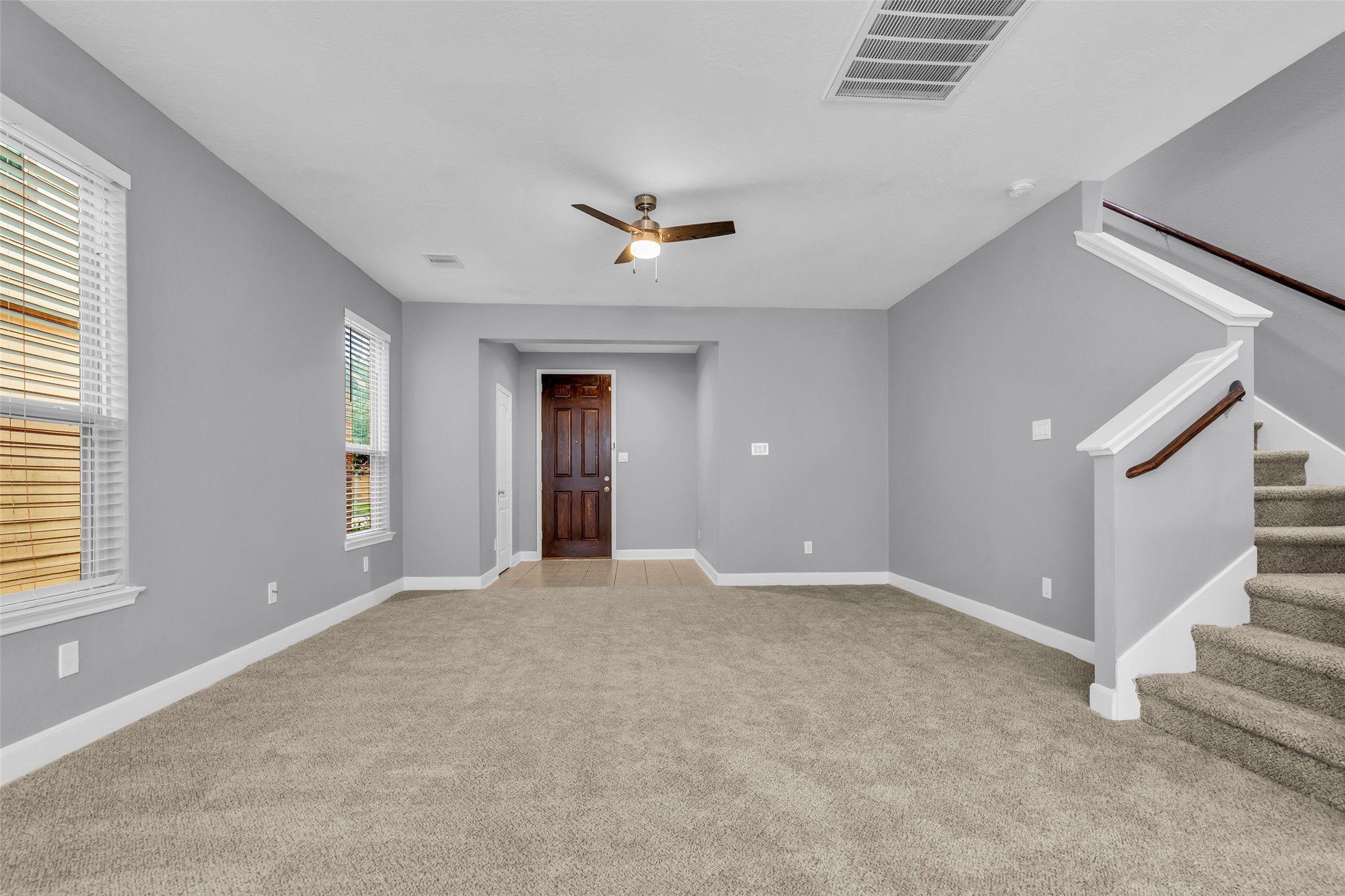 2707 Volute Houston, TX 77038 - Photo 4 of 28 View of the main entrance as seen from the living room, highlighting the entryway’s layout and connection to the home’s interior space.