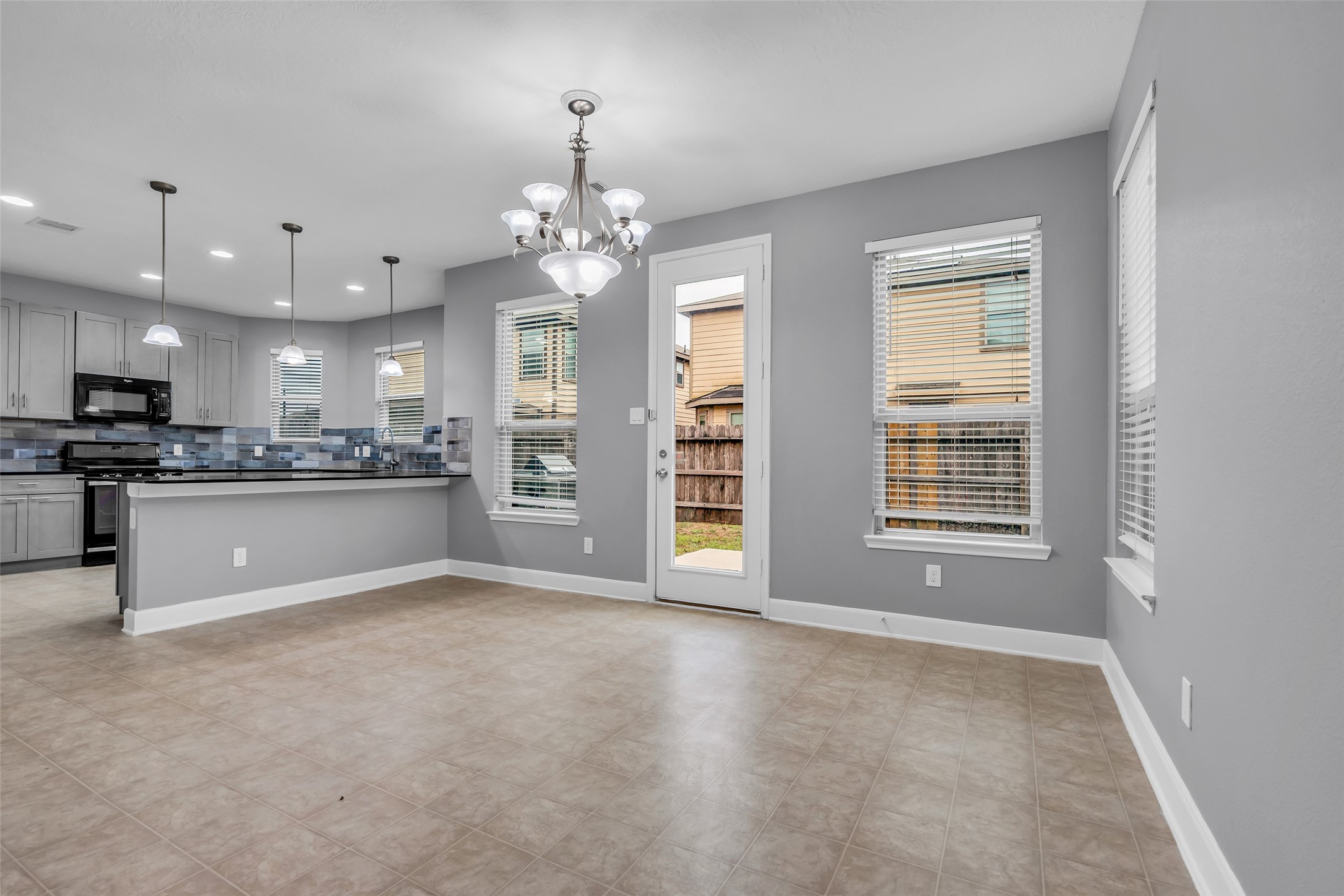 2707 Volute Houston, TX 77038 - Photo 8 of 28 Close-up view of the dining area with a partial view of the kitchen, showing how the spaces connect.