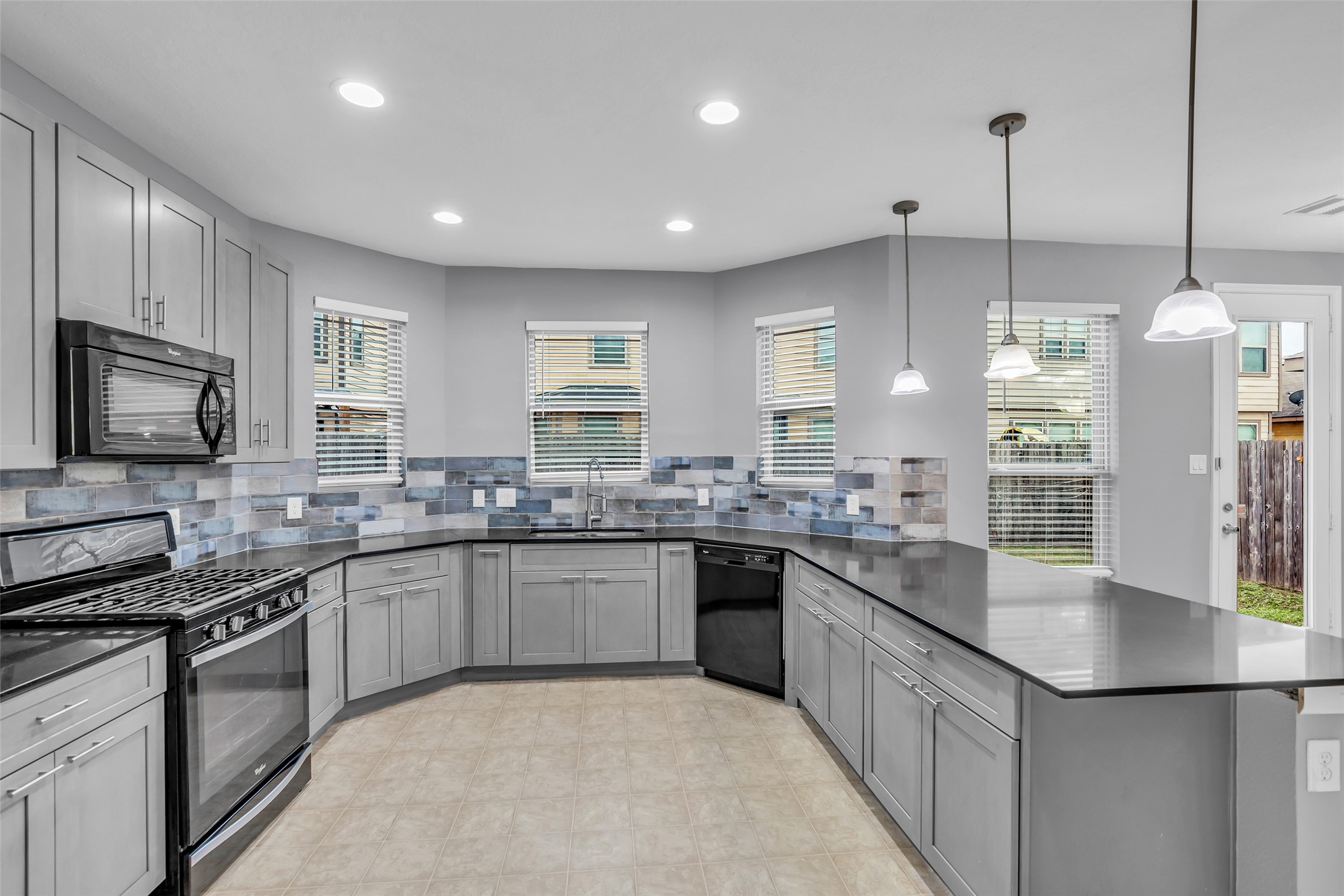 2707 Volute Houston, TX 77038 - Photo 10 of 28 Spacious kitchen designed for easy movement, providing plenty of room for cooking and meal preparation.