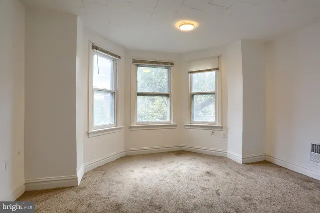 an empty room with windows