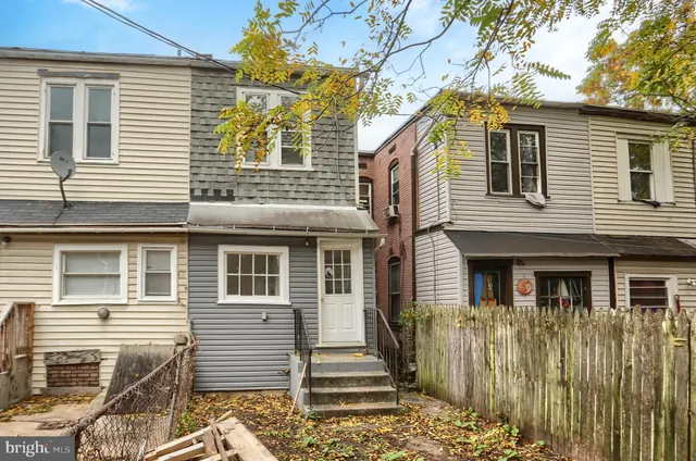 a front view of a house with a porch