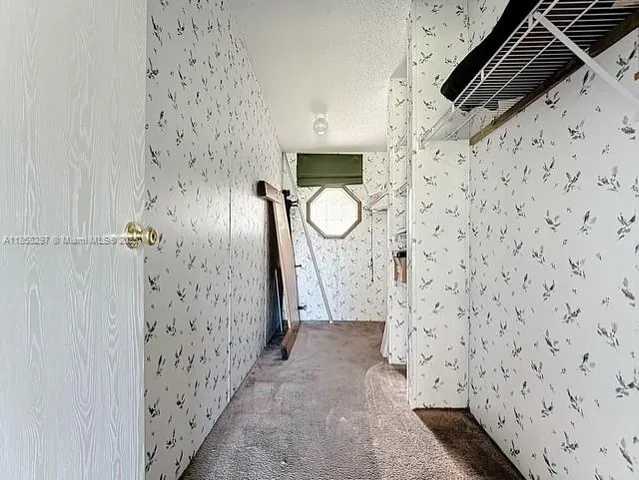 a bathroom with a shower and mirror