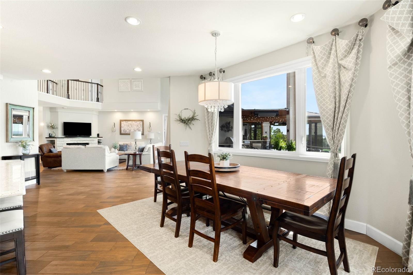 10914 Remmick Ridge Road Parker, CO 80134 - Photo 12 of 47 a view of a dining room with furniture window and wooden floor