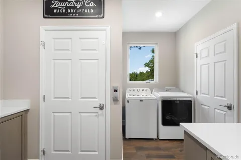 a view of bathroom with a sink and mirror