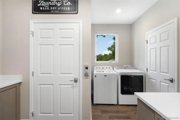 a view of bathroom with a sink and mirror
