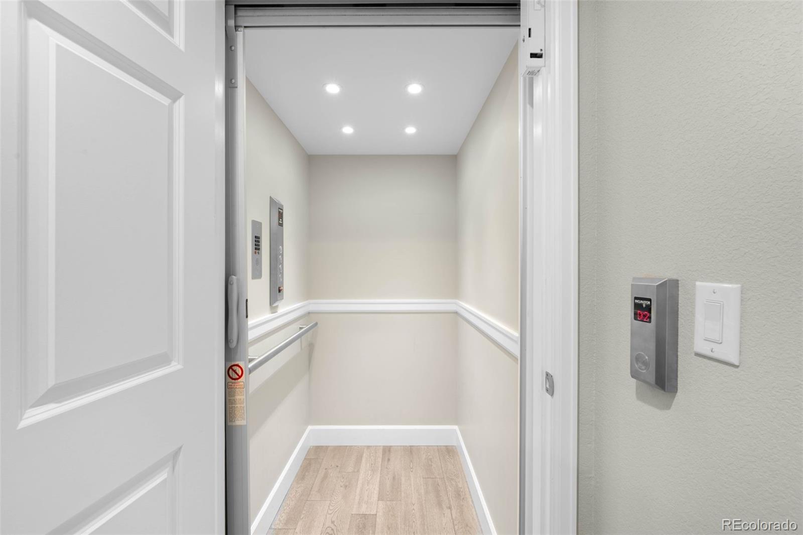 10914 Remmick Ridge Road Parker, CO 80134 - Photo 22 of 47 a view of a hallway with white walls