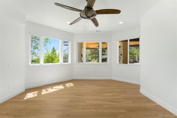 a view of an empty room with windows