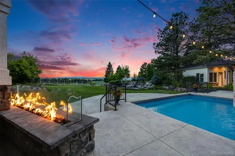 a view of a swimming pool with a patio