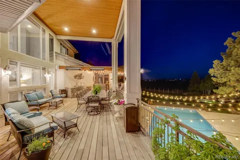 a view of a swimming pool with outdoor seating
