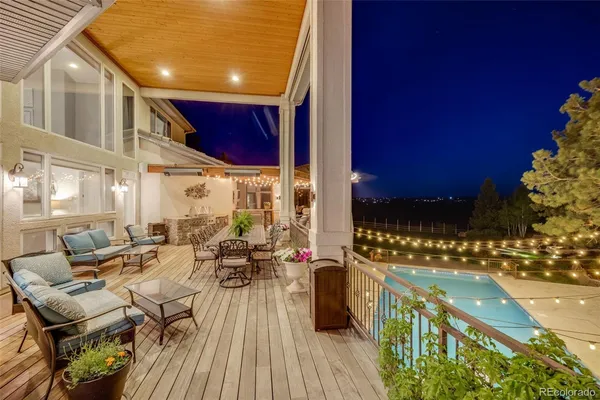 a view of a swimming pool with outdoor seating