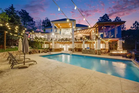 a view of a swimming pool with an outdoor space and seating area