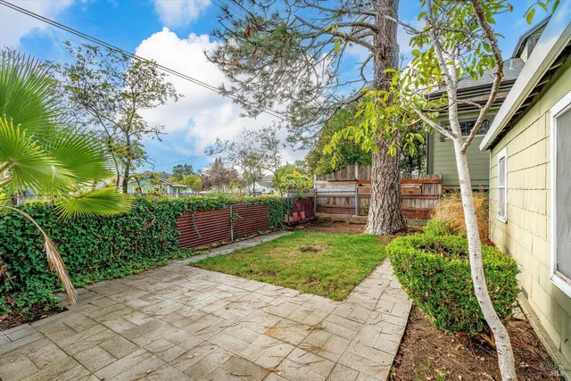 a backyard of a house with lots of green space