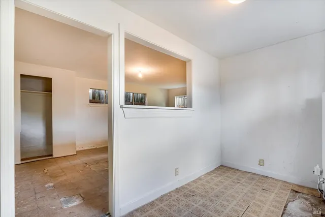 an empty room with a mirror