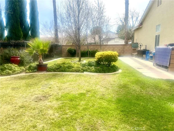 a view of yard with swimming pool