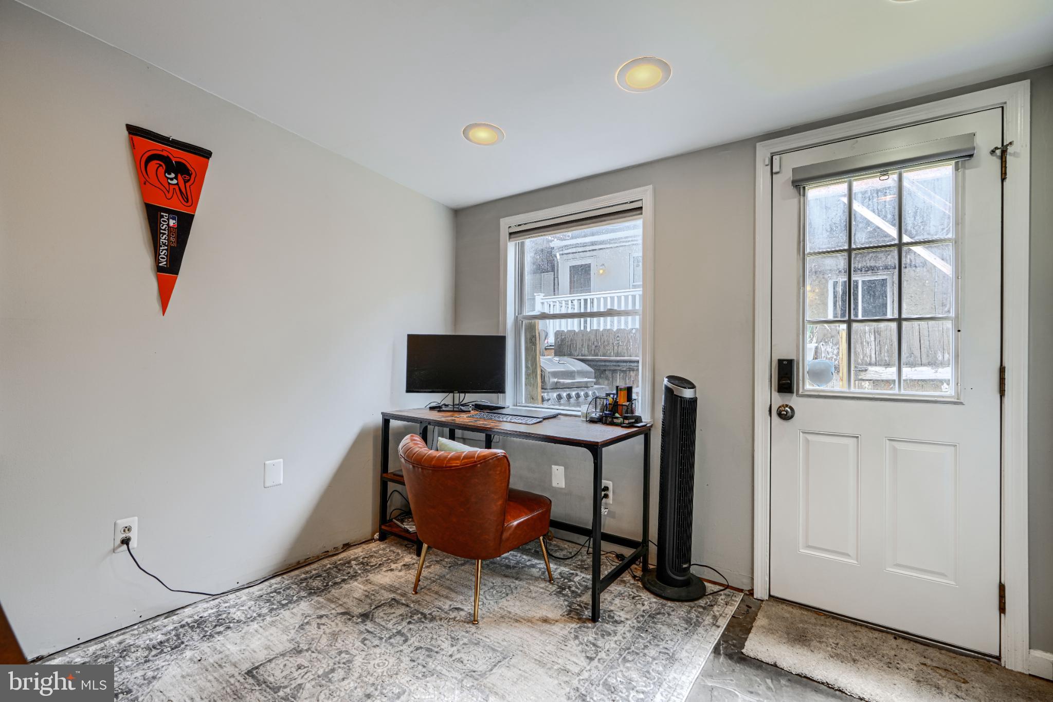 438 East Clement Street Baltimore, MD 21230 - Photo 17 of 47 a view of a workspace with furniture and a window