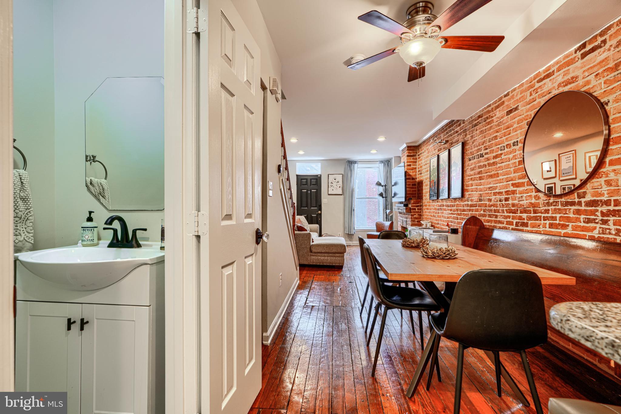 438 East Clement Street Baltimore, MD 21230 - Photo 22 of 47 a view of a dining room with furniture and a chandelier
