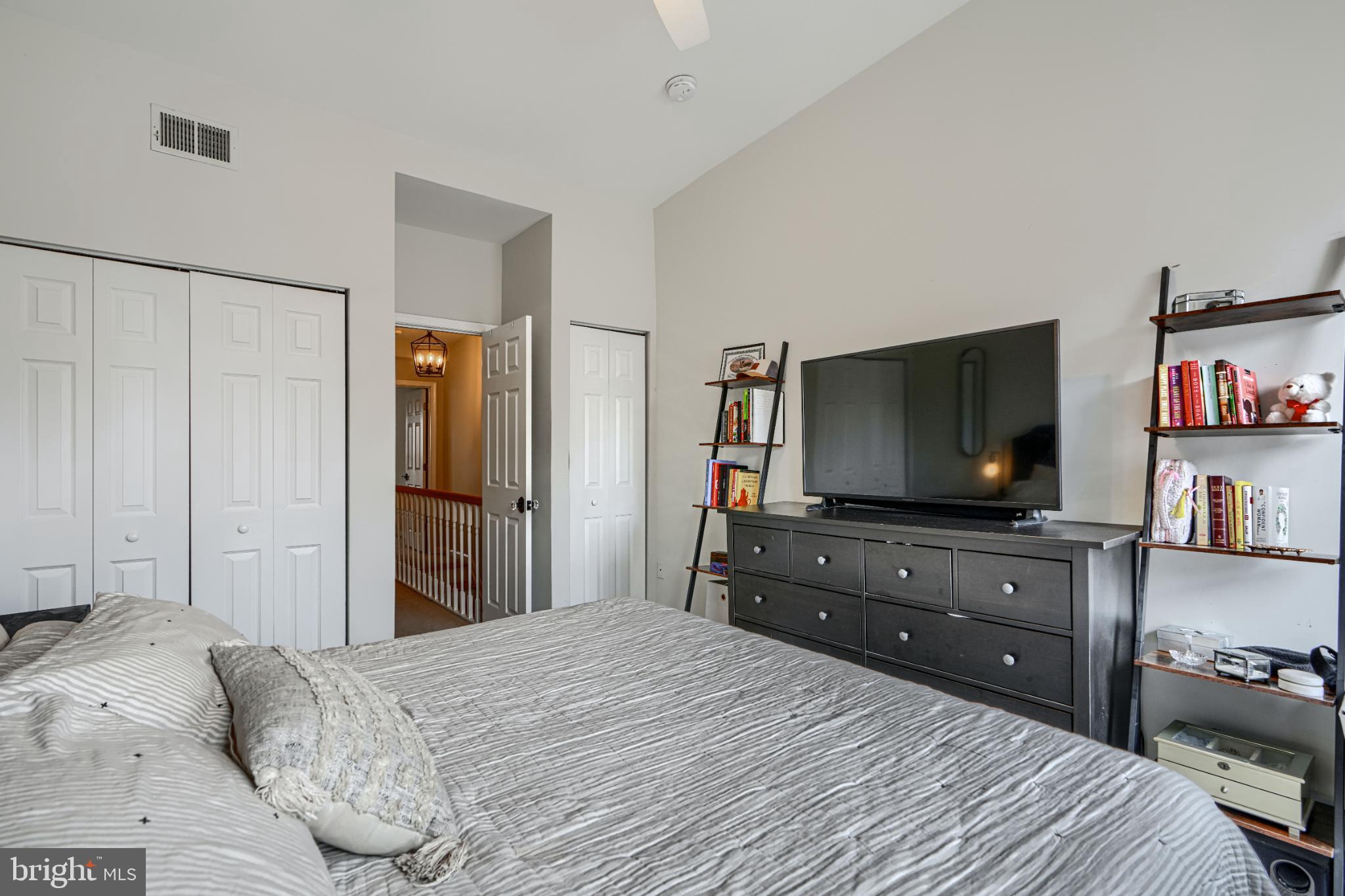 438 East Clement Street Baltimore, MD 21230 - Photo 25 of 47 a bedroom with a bed and a flat screen tv