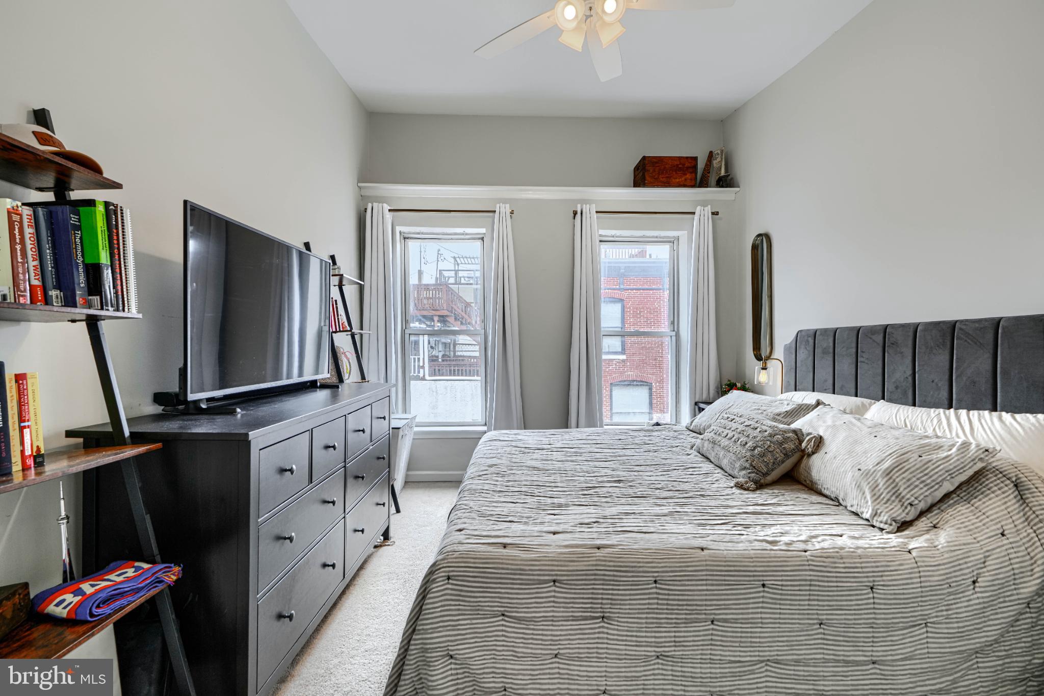 438 East Clement Street Baltimore, MD 21230 - Photo 26 of 47 a bedroom with a bed and flat screen tv
