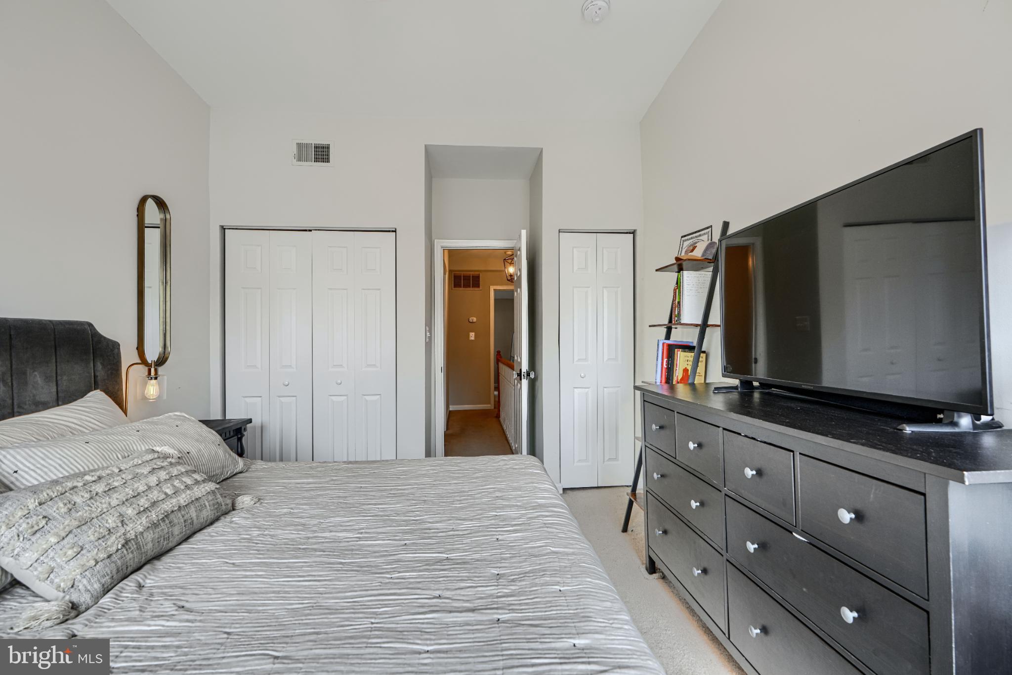 438 East Clement Street Baltimore, MD 21230 - Photo 27 of 47 a bedroom with a bed and a flat screen tv