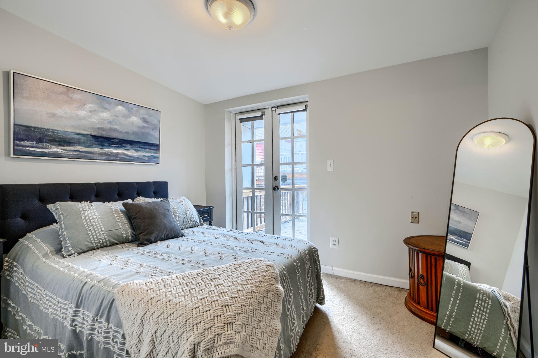 438 East Clement Street Baltimore, MD 21230 - Photo 32 of 47 a bedroom with a bed and wooden floor
