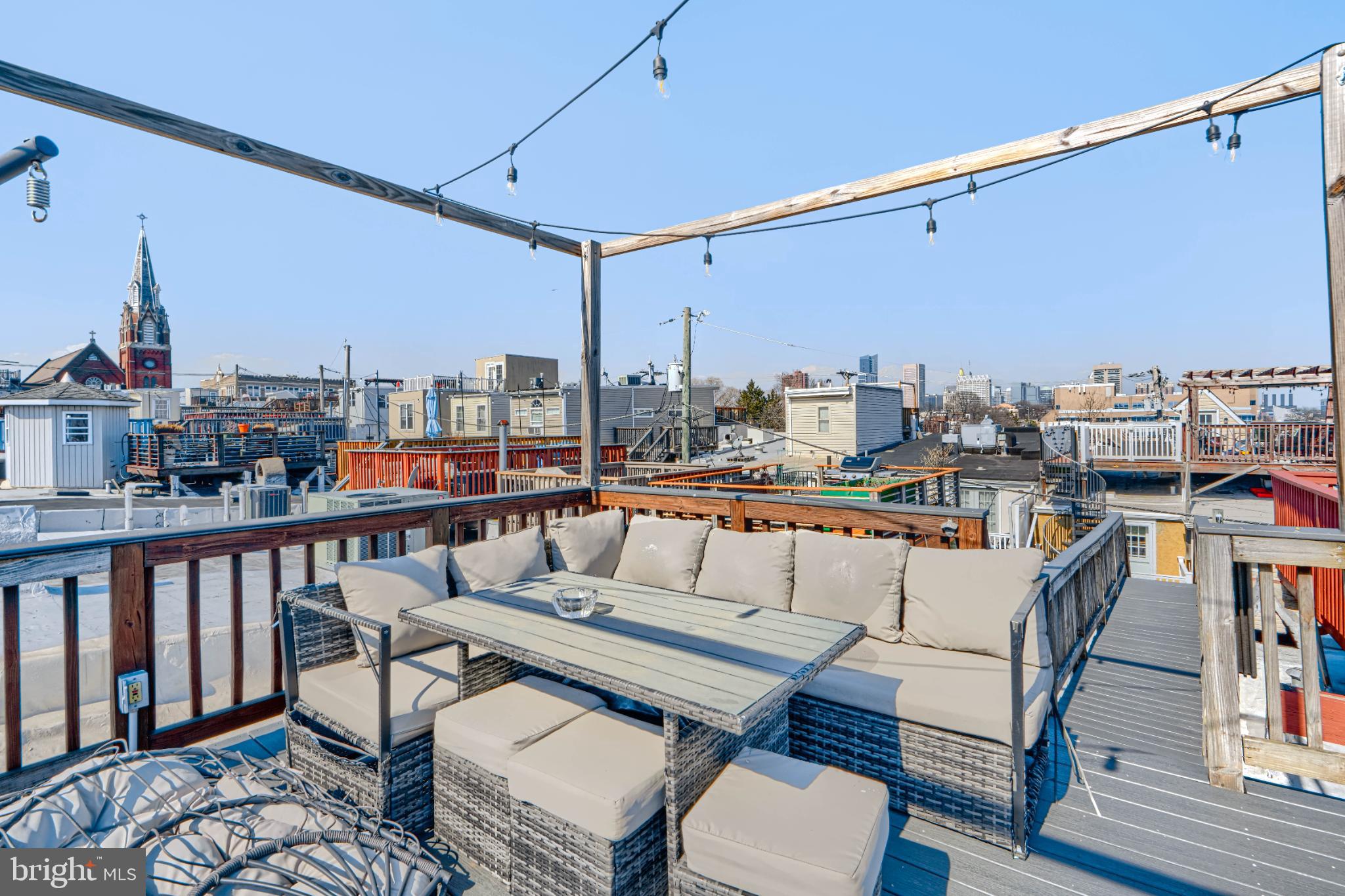 438 East Clement Street Baltimore, MD 21230 - Photo 36 of 47 a roof deck with table and chairs