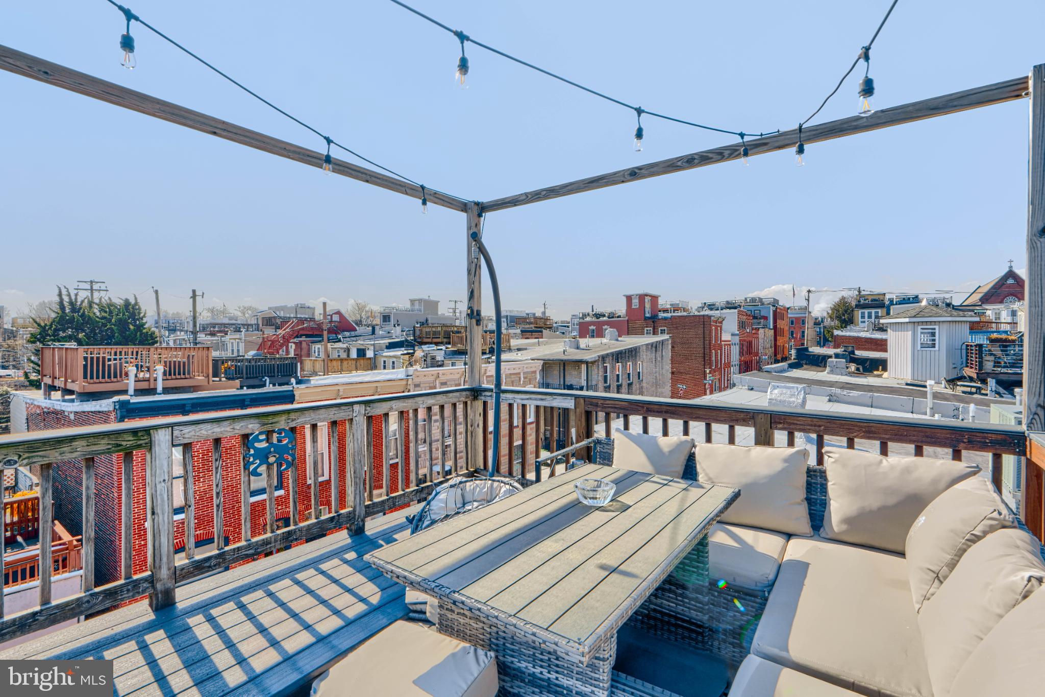 438 East Clement Street Baltimore, MD 21230 - Photo 39 of 47 a view of a balcony with wooden benches
