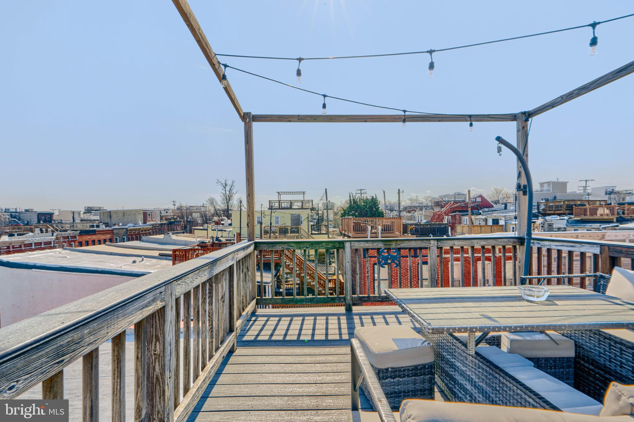 438 East Clement Street Baltimore, MD 21230 - Photo 40 of 47 a view of a balcony with wooden benches
