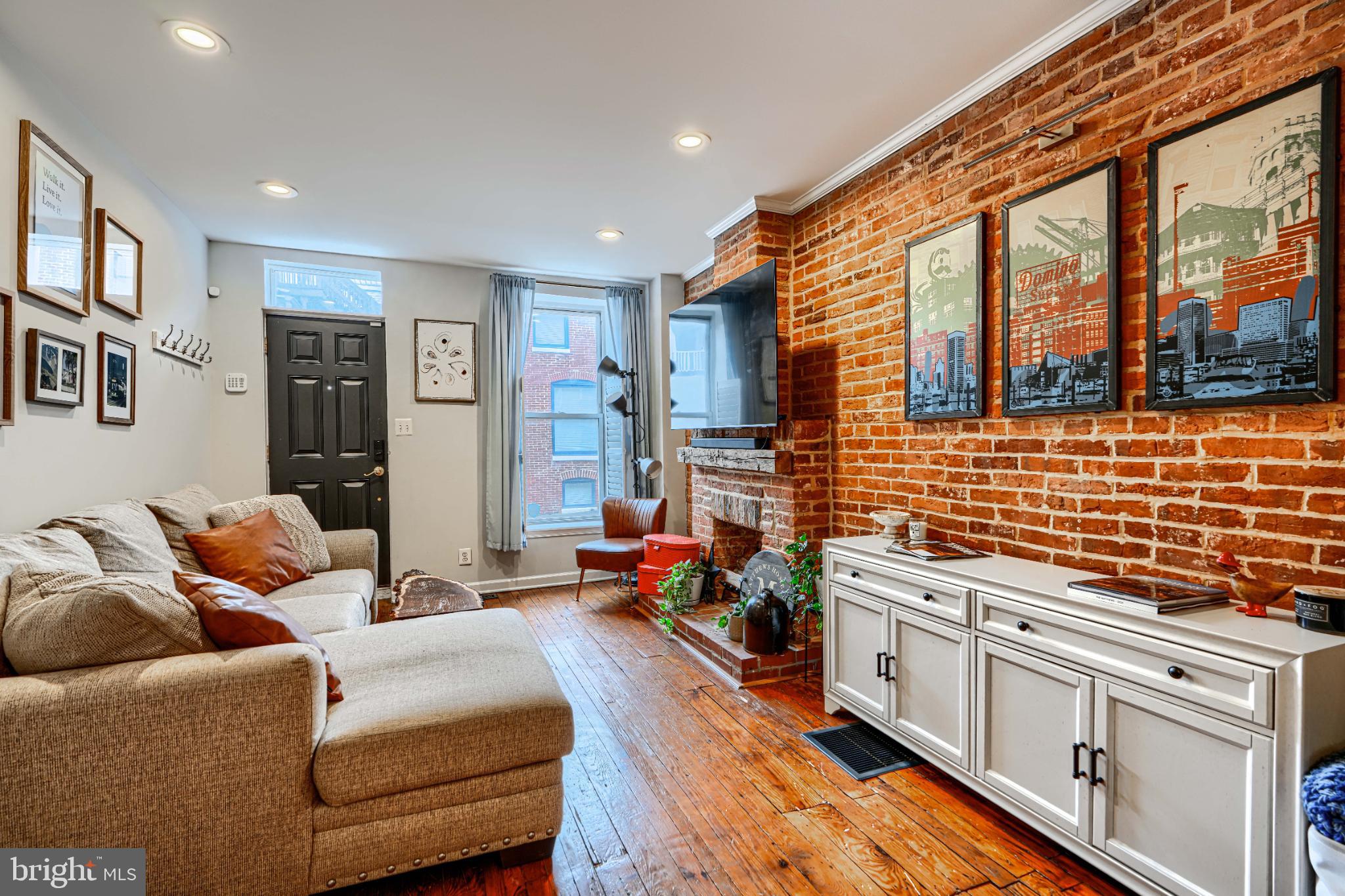 438 East Clement Street Baltimore, MD 21230 - Photo 5 of 47 a living room with furniture a rug kitchen view and a large window