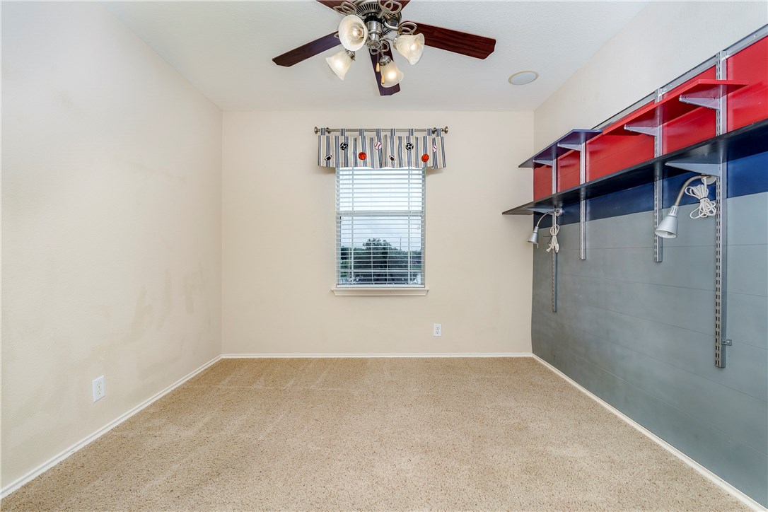 8528 Harrier Drive, Unit 233 Austin, TX 78729 - Photo 18 of 27 a view of a hallway with a window