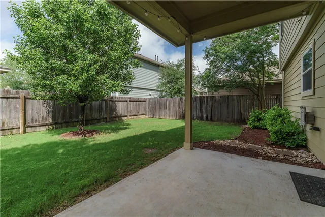 a view of a backyard with a garden