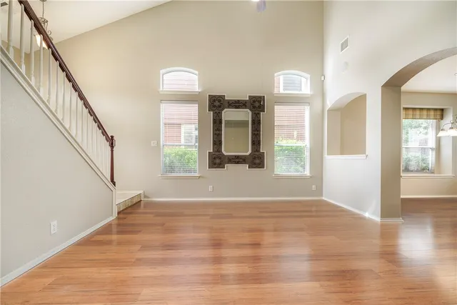 a view of an entryway with wooden floor and windows