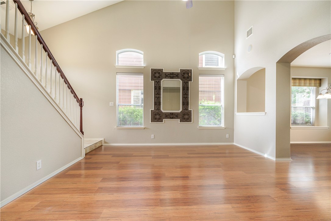 8528 Harrier Drive, Unit 233 Austin, TX 78729 - Photo 10 of 27 a view of an entryway with wooden floor and windows