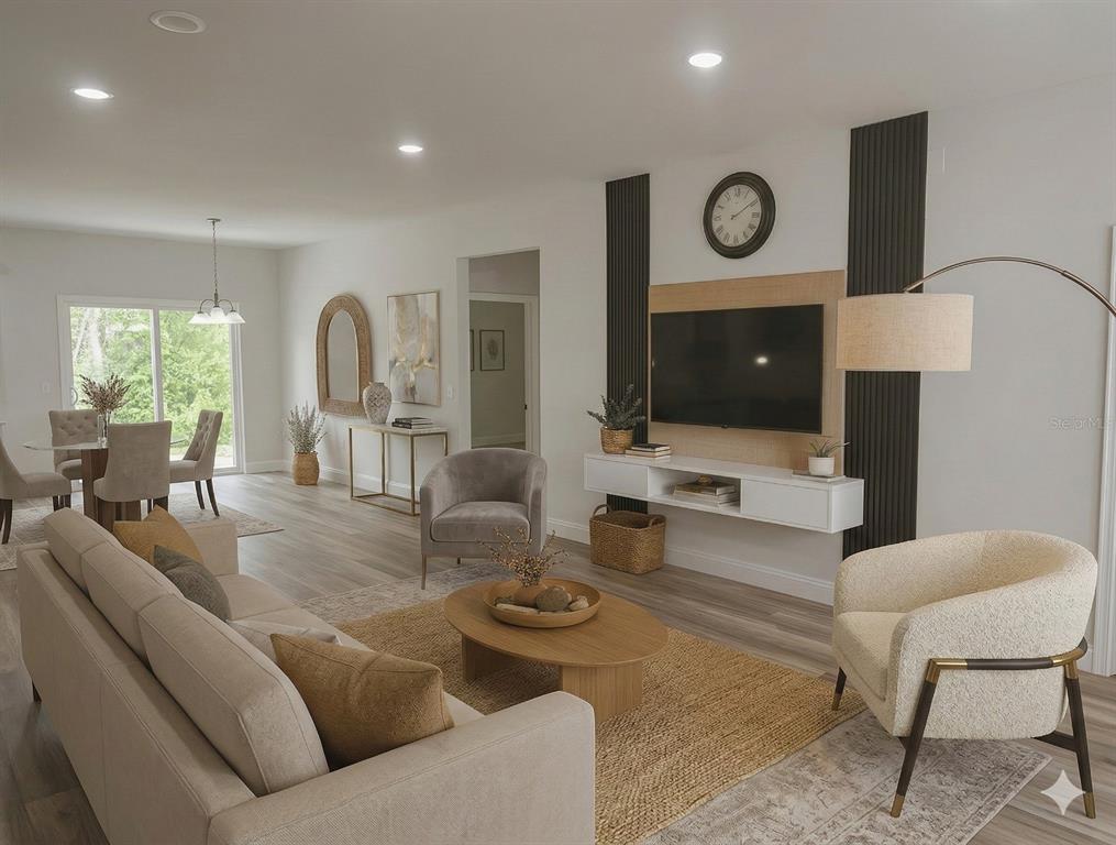 2644 Southwest 162nd Street Road Ocala, FL 34473 - Photo 10 of 47 a living room with furniture and a clock