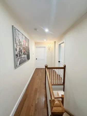 a view of a hallway with staircase