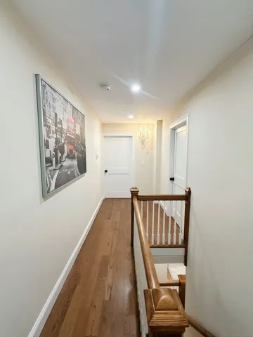 a view of a hallway with staircase