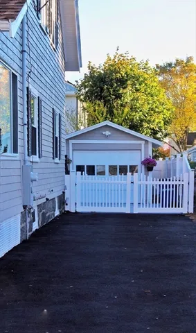 a view of balcony with wooden floor and fence