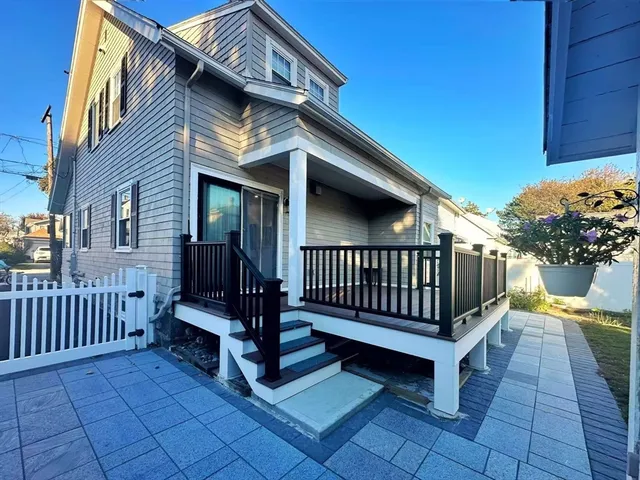 a view of backyard with deck and deck