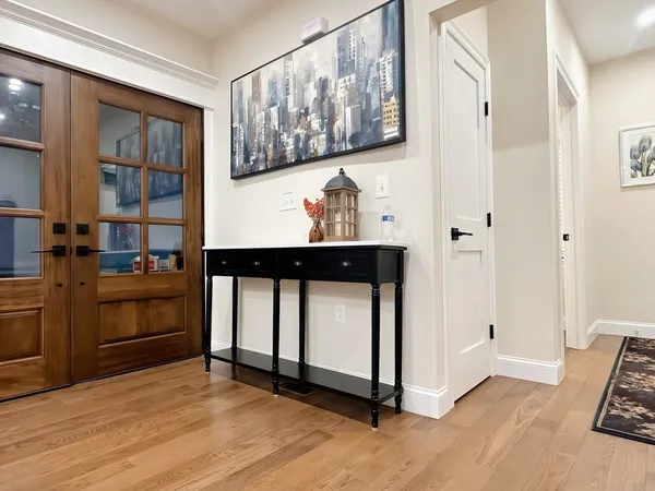 a view of kitchen with furniture and electronic appliances