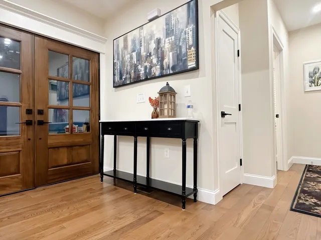 a view of kitchen with furniture and electronic appliances
