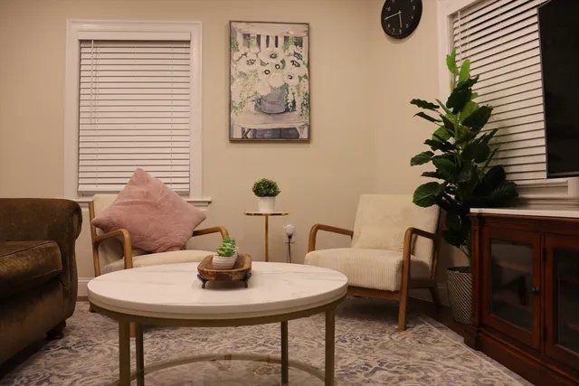 a dining room with table and chairs