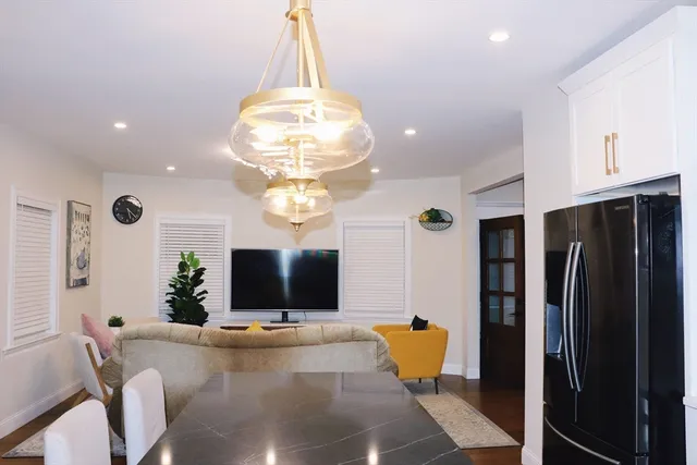 a dining room with chandelier