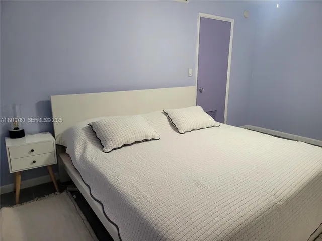 a view of garage with a car parked in it