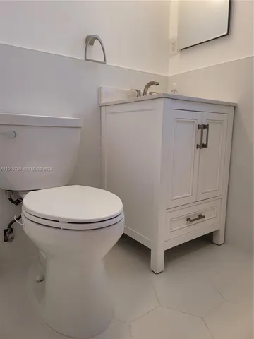 a view of a street with a building in the background