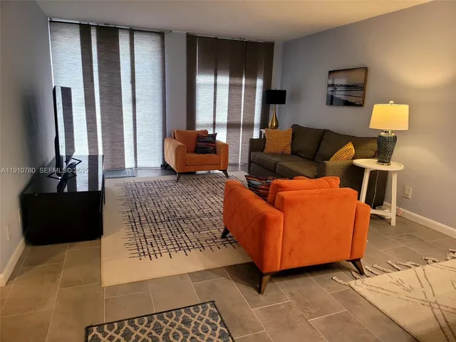 a view of hallway with a large window and closet