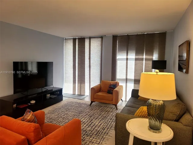 a kitchen with stainless steel appliances a stove a microwave and sink